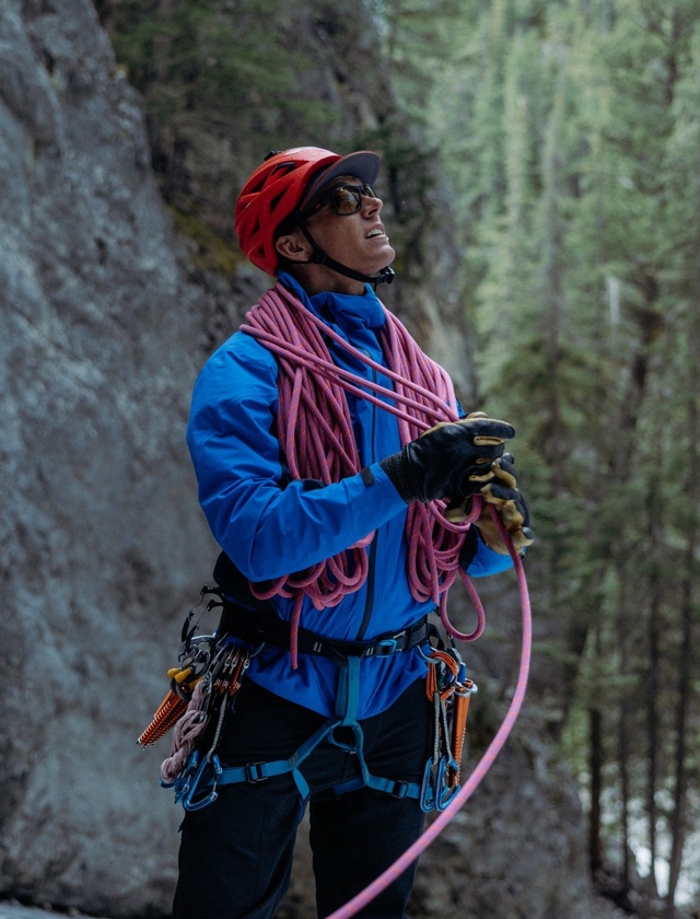A man wearing THE ONE™ jacket while climbing