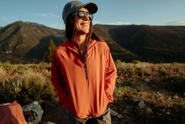 A women smiling and wearing Kühl clothes.